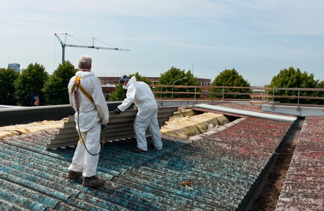 Two workers inspecting the inside of a roof. The specialist personal injury barristers at Linenhall have extensive experience of dealing with all types of industrial disease cases.